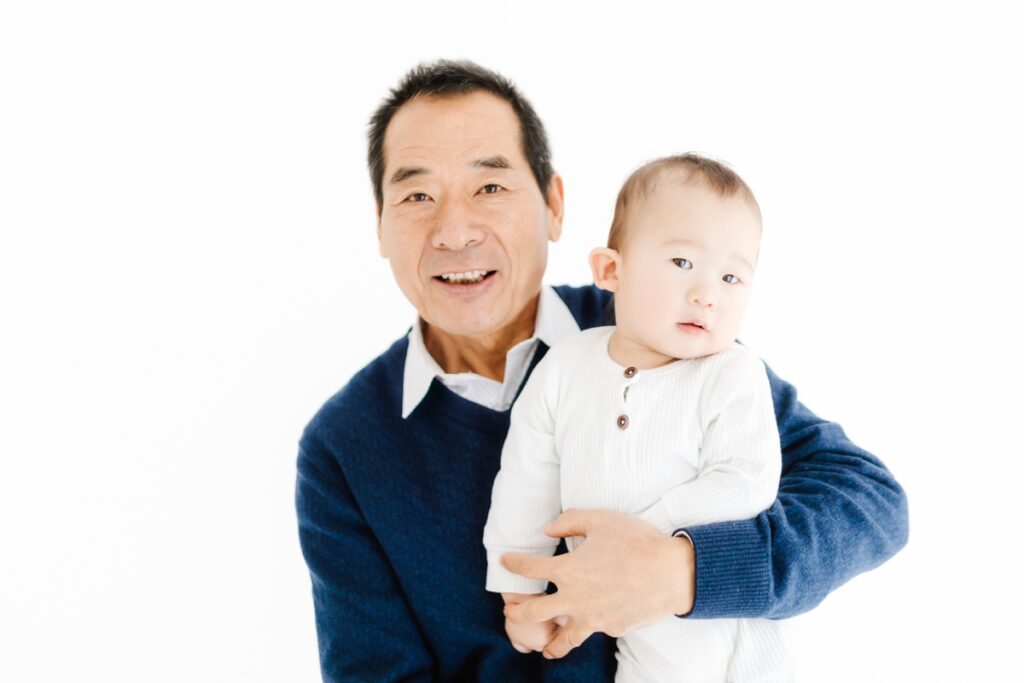 Grandfather and grandchild first birthday photoshoot portrait - Rebecca Casey Photography