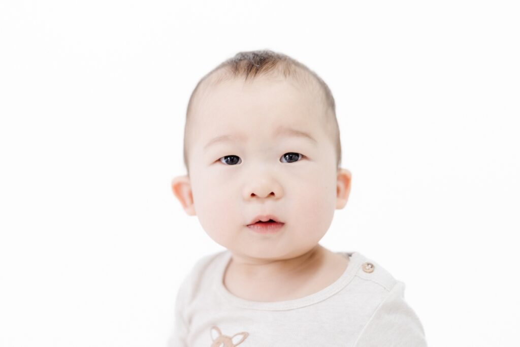 Natural light first birthday portrait in studio. Rebecca Casey Photography