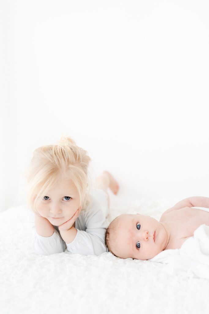Beautiful baby and sibling portraits created in a calm and natural Westbury photography studio.